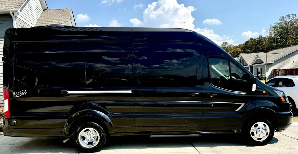 Black high-roof Sprinter limousine van